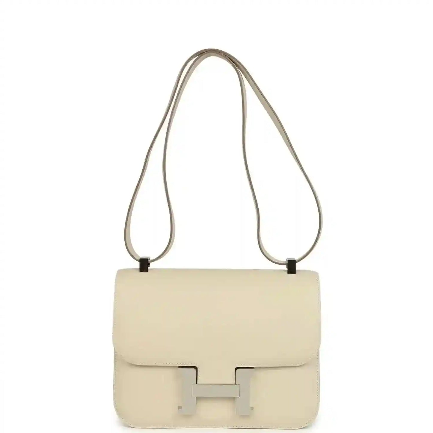 Beige leather shoulder handbag with flap and light silver clasp, long strap