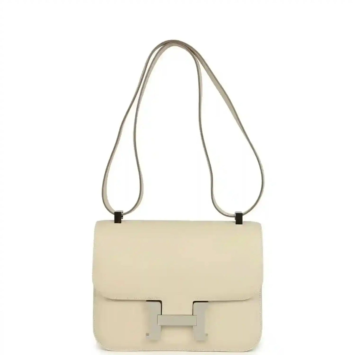 Beige leather shoulder handbag with flap and light silver clasp, long strap