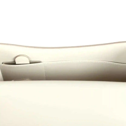 Hermes Constance handbag in cream leather with top flap and strap loop, metal hardware