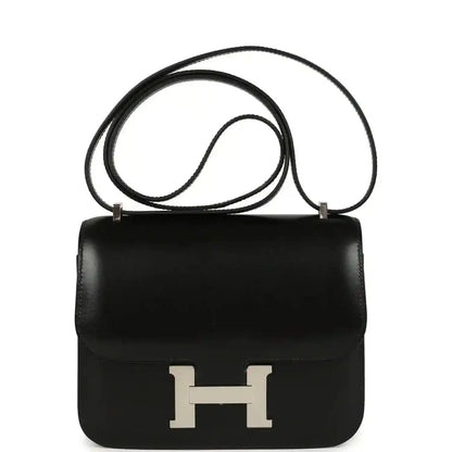 Black calfskin crossbody bag with front flap and H clasp, palladium hardware.