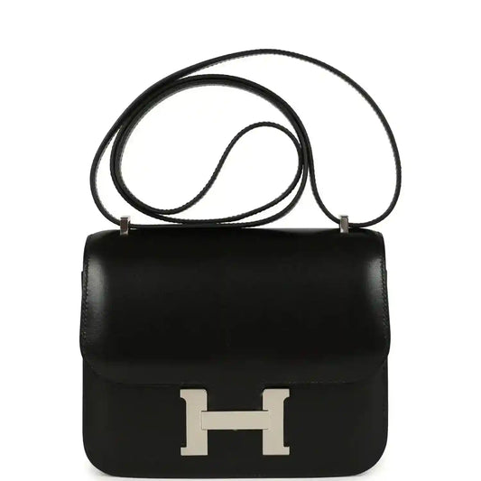 Black calfskin crossbody bag with front flap and H clasp, palladium hardware.