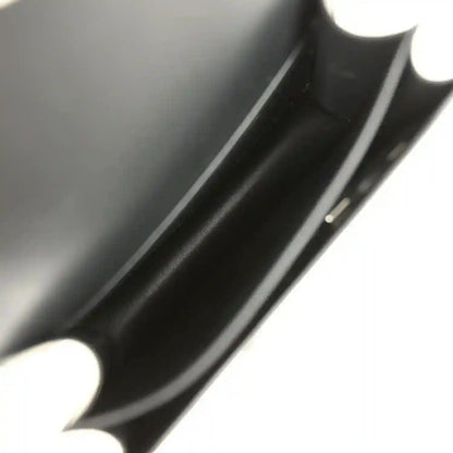 Black calfskin interior close-up with seam and edge trim.