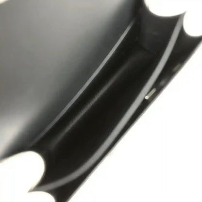 Black calfskin interior close-up with seam and edge trim.