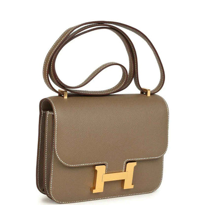 Etoupe Constance 18 crossbody bag with gold H clasp and long shoulder strap