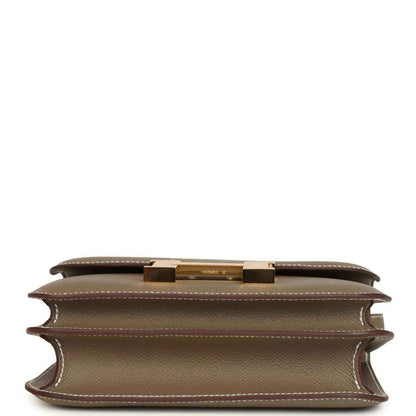 Etoupe Constance 18 crossbody bag interior opening with gold top clasp hardware