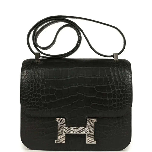 Black crocodile-pattern flap bag with gold H clasp and top handle