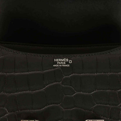 Hermes Paris label inside black crocodile-pattern bag