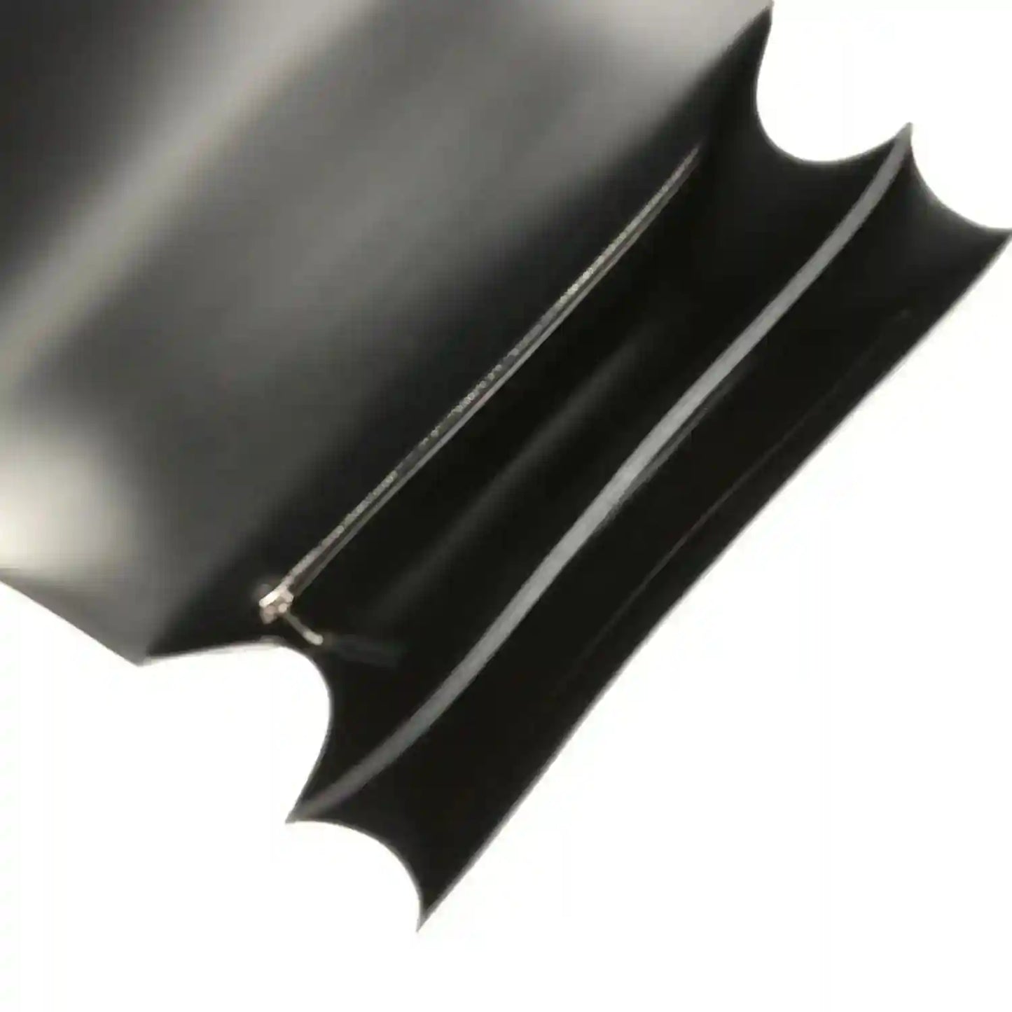 Black fabric interior lining with stitched piping on the bag