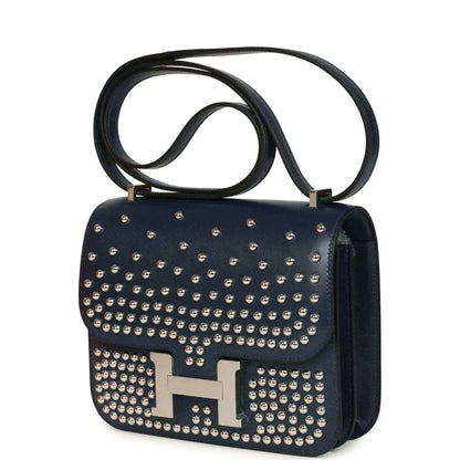 Blue studded leather flap shoulder bag with H clasp and dark leather side panel