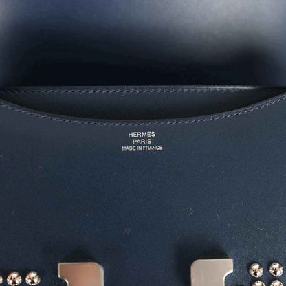 Hermes Paris made in France text on interior lining of blue leather bag