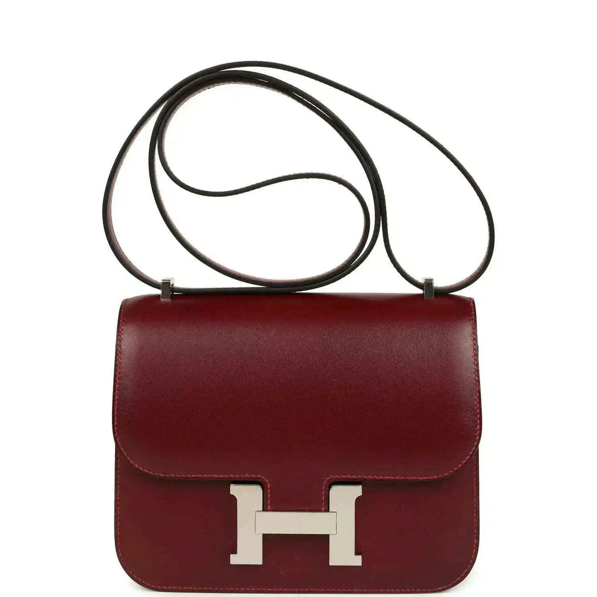 Burgundy leather crossbody bag with top handle and silver H clasp front.