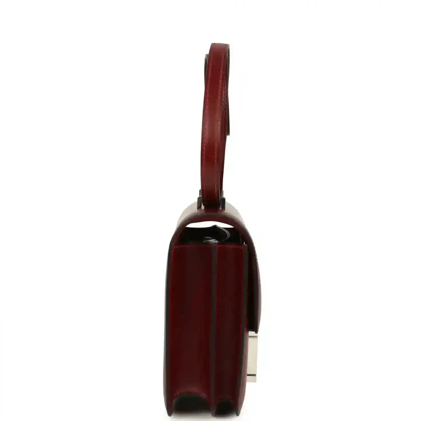 Burgundy leather bag side profile with structured edges and metal hardware.