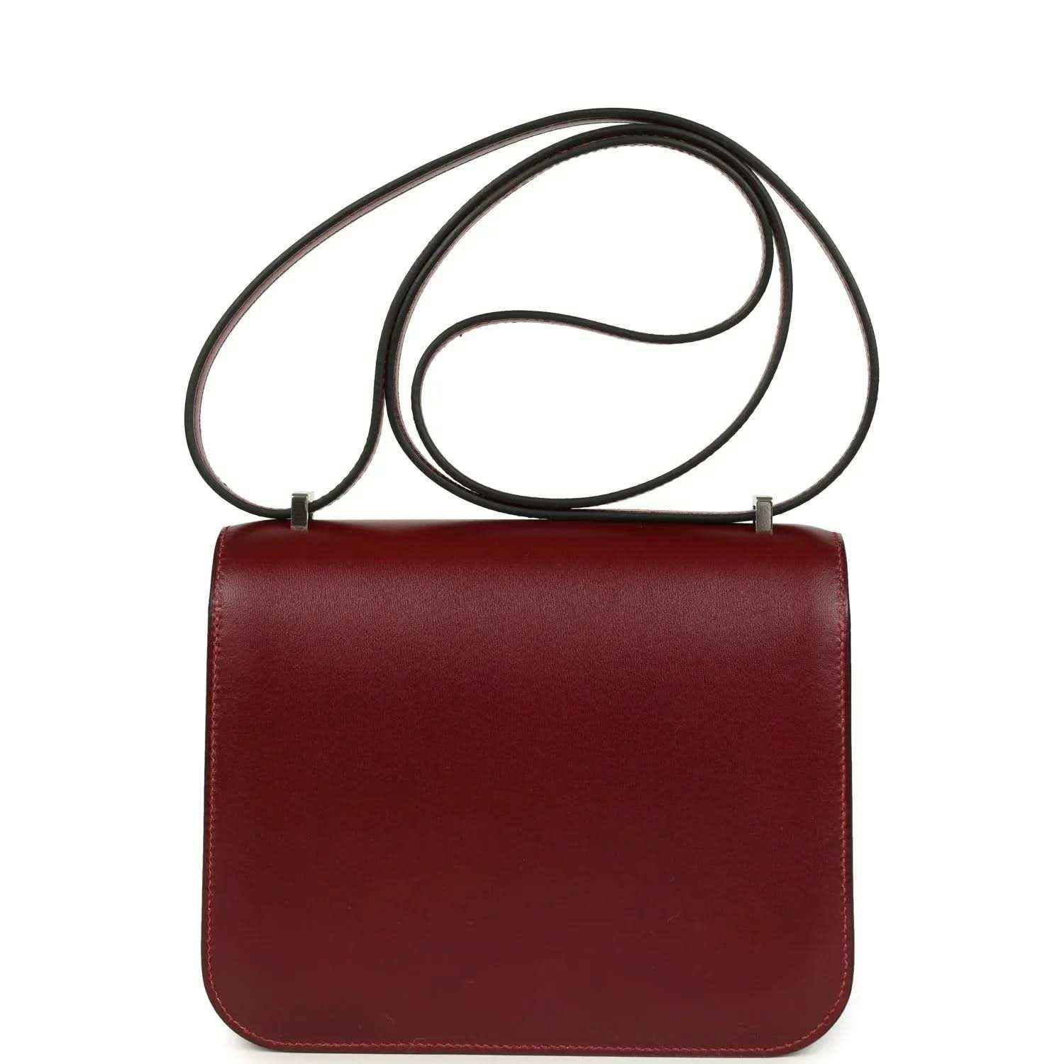Burgundy leather top-handle bag with straps and plain front flap.