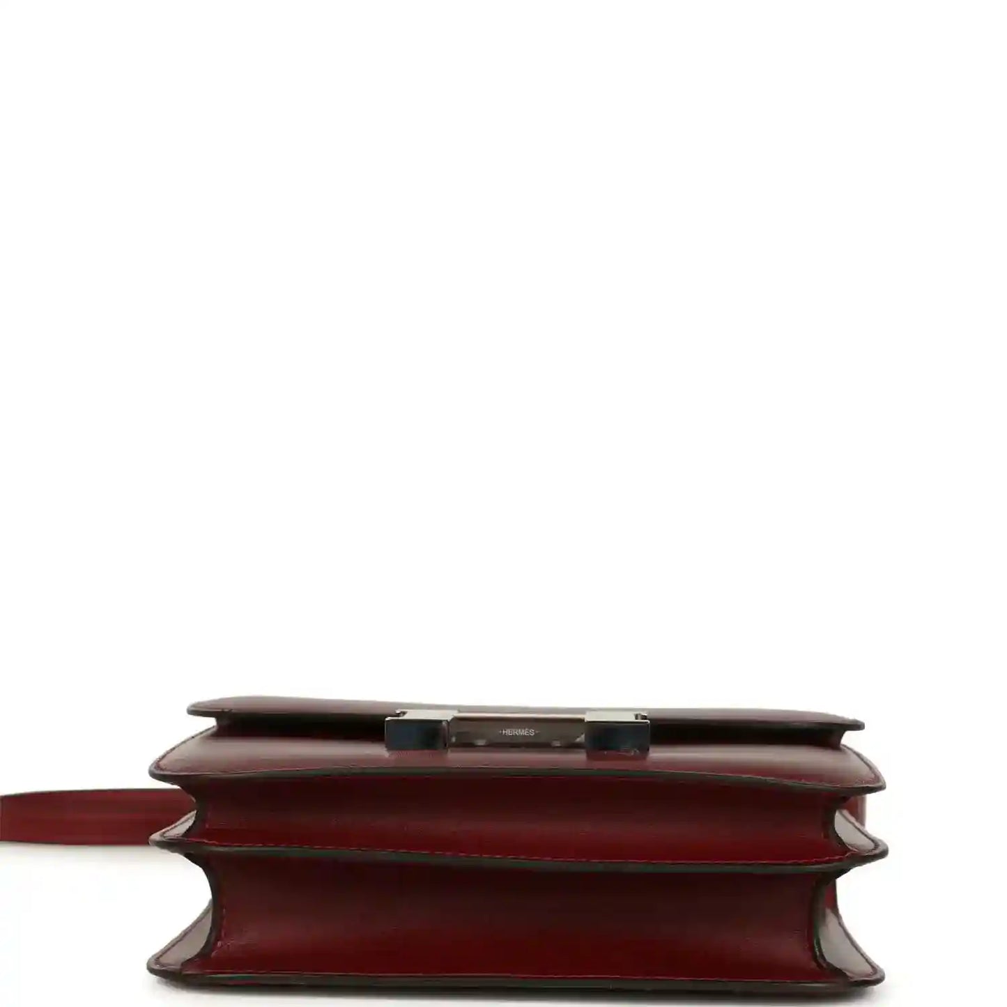 Burgundy leather bag showing back view with turn-lock hardware and seams.