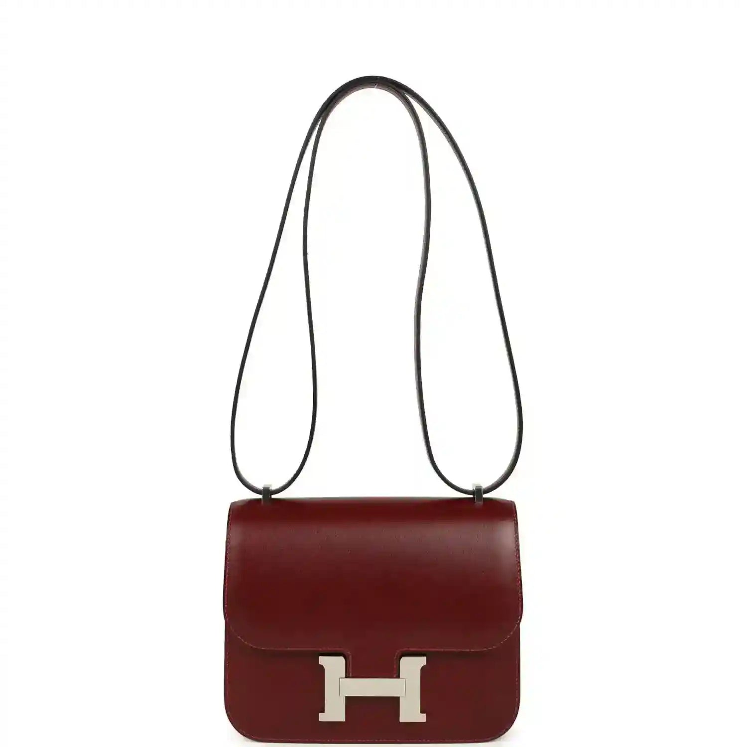 Burgundy leather crossbody bag with long strap and silver H clasp.