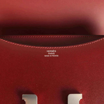 Burgundy leather interior with stitched edge and HERMÈS Paris Made in France stamp.