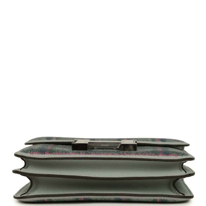 Tartan plaid leather handbag base detail with snap trim and folded edges