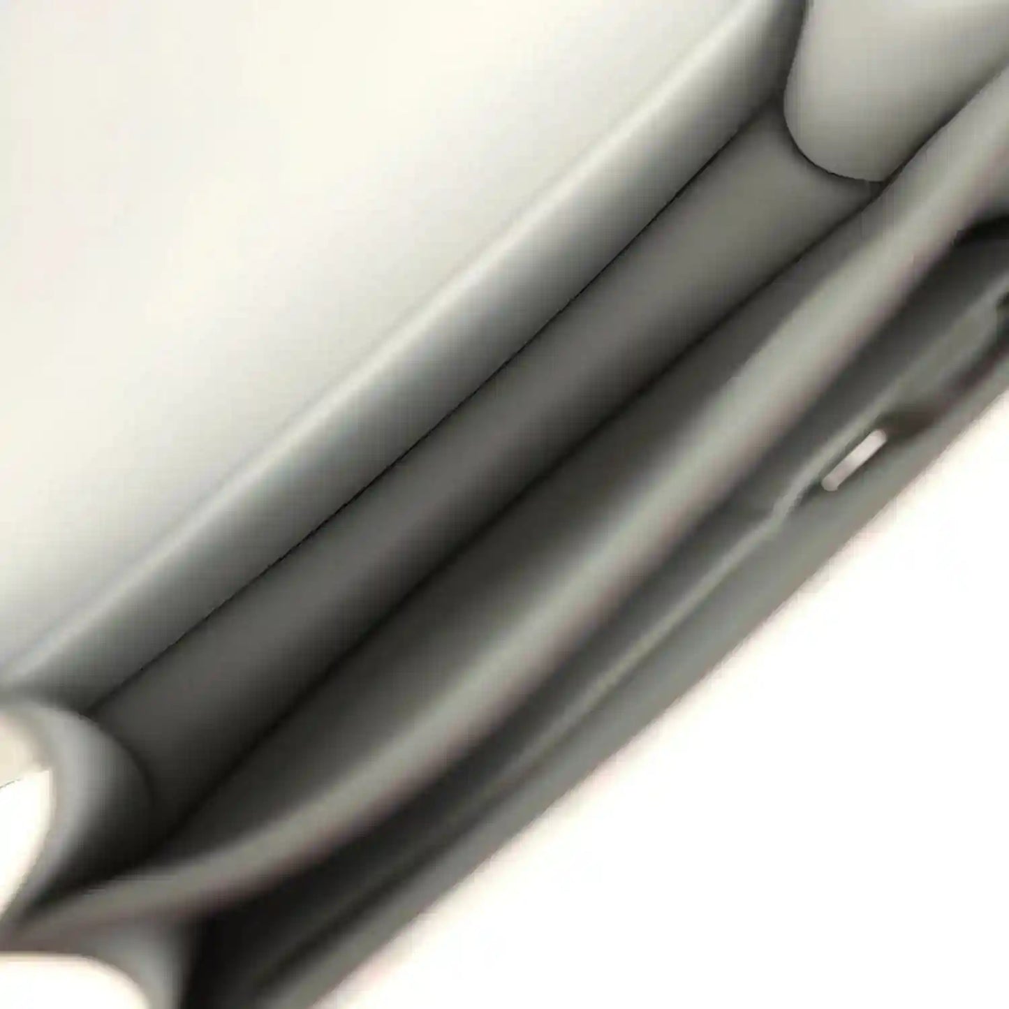Leather handbag interior lining with smooth gray panels