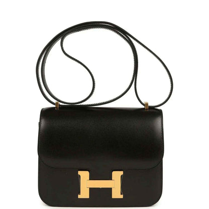 Black calfskin handbag with gold-tone H clasp and top handle strap