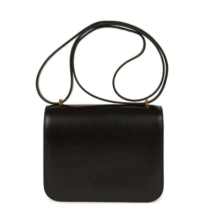 Black calfskin handbag with top handle strap and structured rectangular body