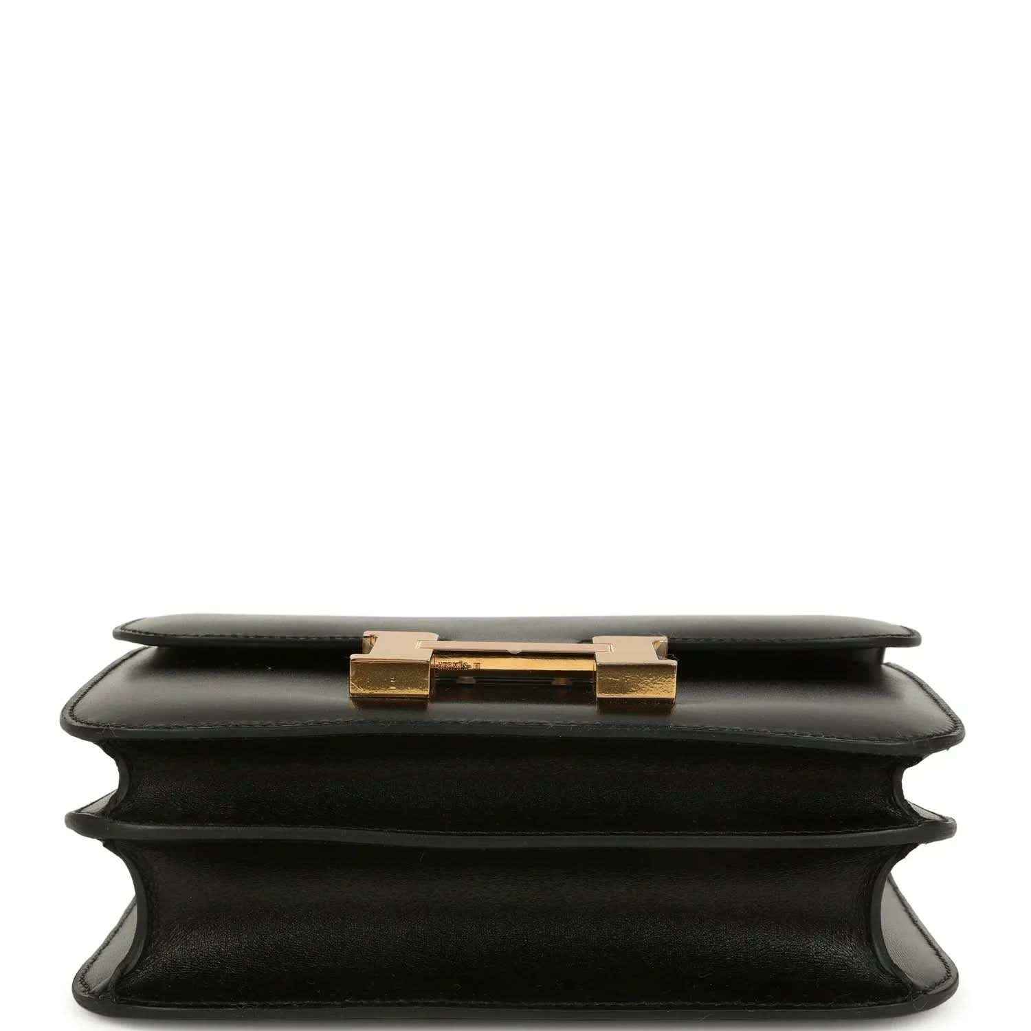 Black calfskin handbag top view with gold-tone clasp on the front flap