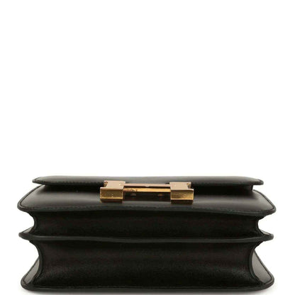 Black calfskin handbag top view with gold-tone clasp on the front flap