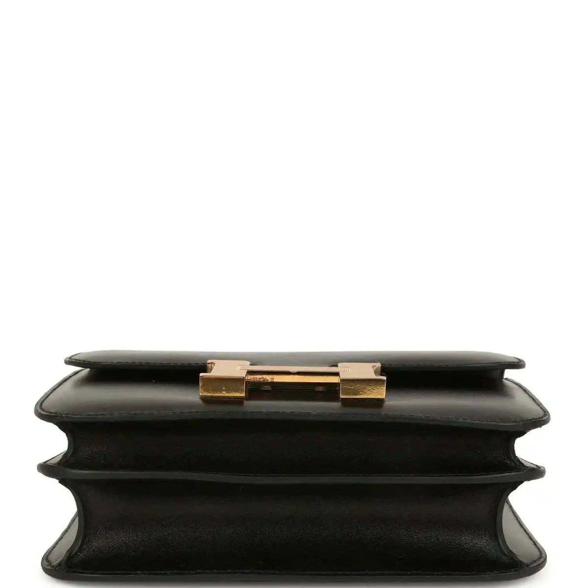 Black calfskin handbag top view with gold-tone clasp on the front flap