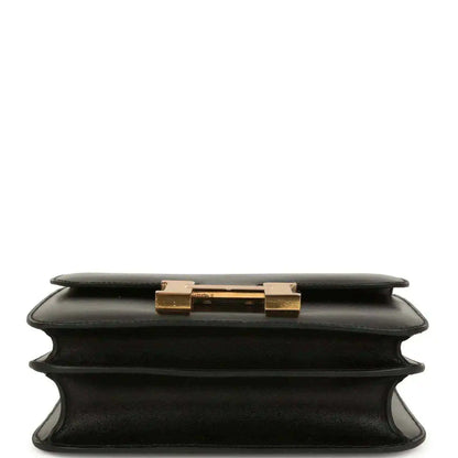 Black calfskin handbag top view with gold-tone clasp on the front flap