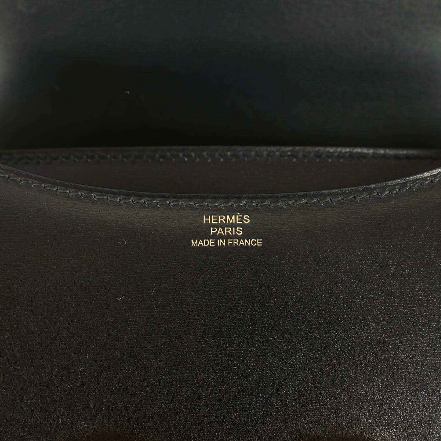 Black calfskin handbag interior with Hermes Paris stamp and stitched trim