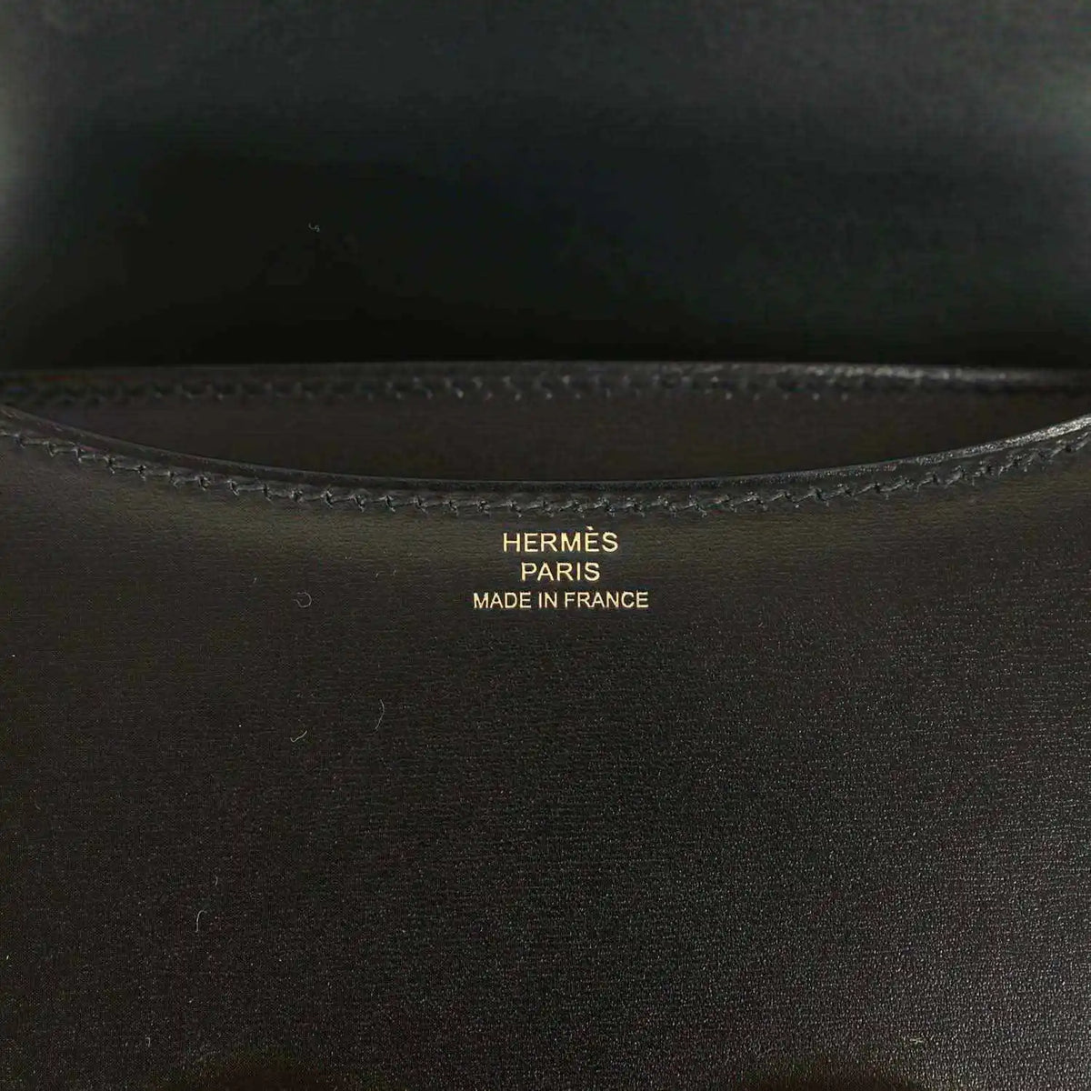 Black calfskin handbag interior with Hermes Paris stamp and stitched trim