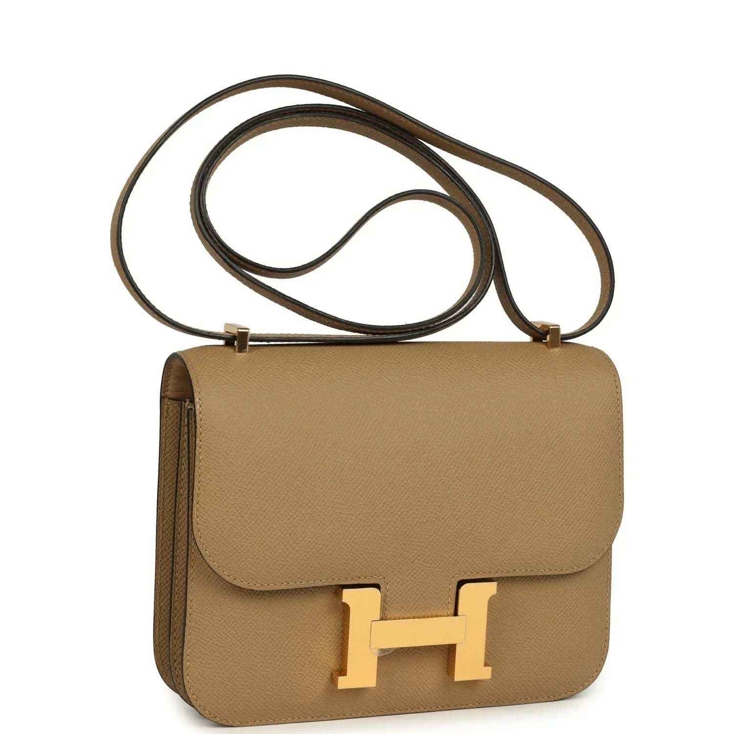 Tan leather crossbody bag with front flap and gold H clasp, adjustable crossbody strap
