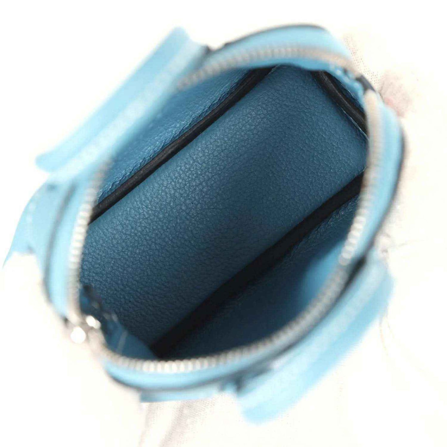 Hermes shark bag charm in blue leather, open top showing textured interior
