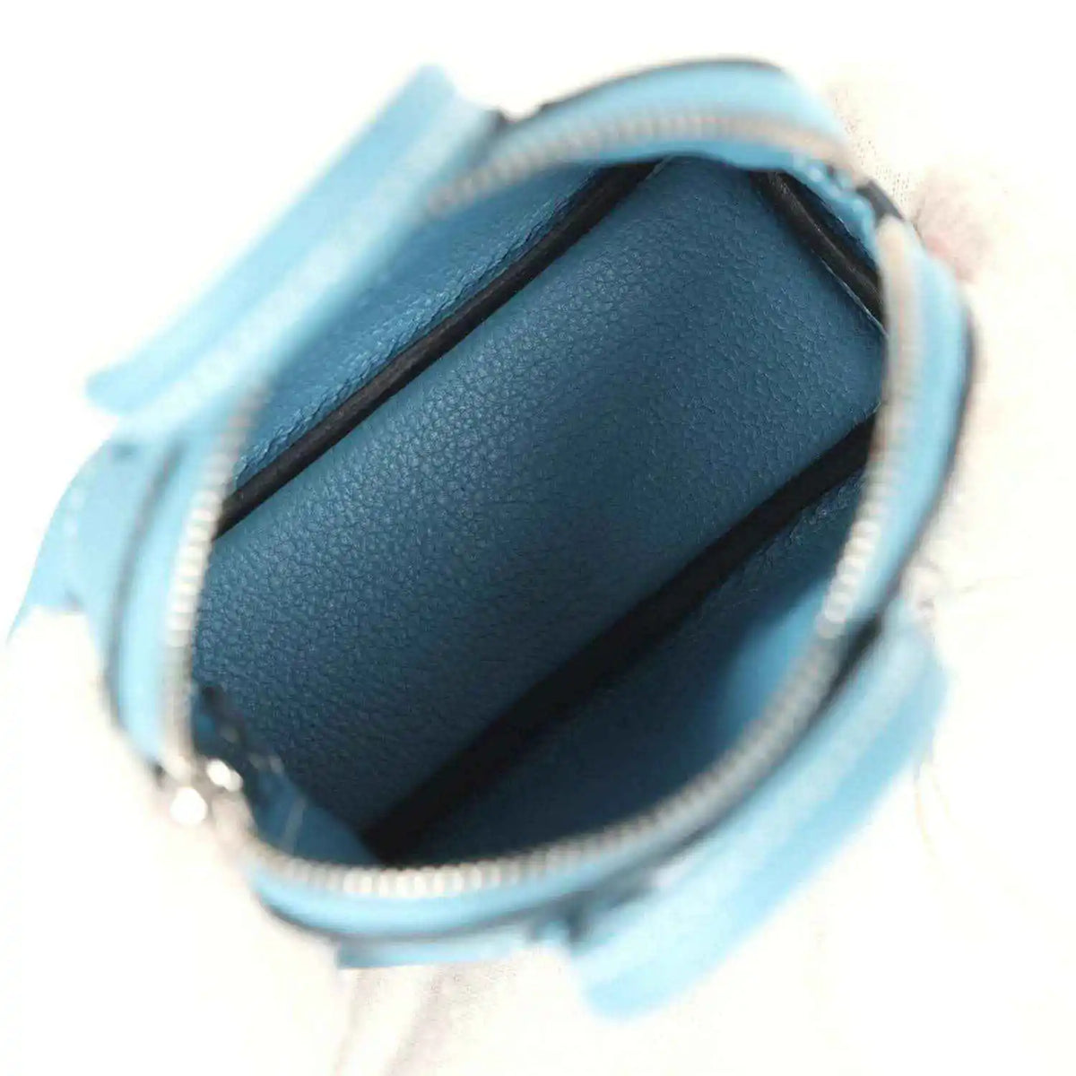 Hermes shark bag charm in blue leather, open top showing textured interior