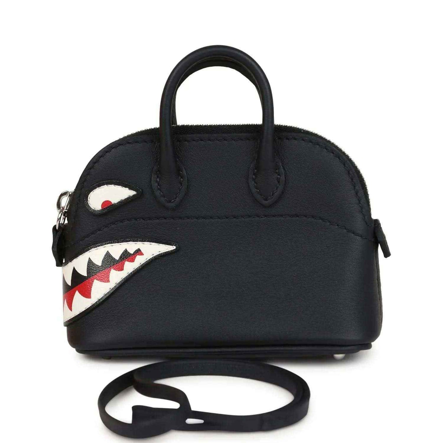 Black mini bag charm with top handles, shark mouth applique, and attached strap