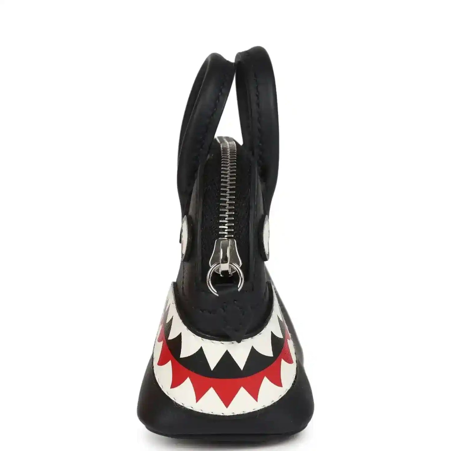 Black mini bag charm with top handles, visible zipper, and shark mouth graphic