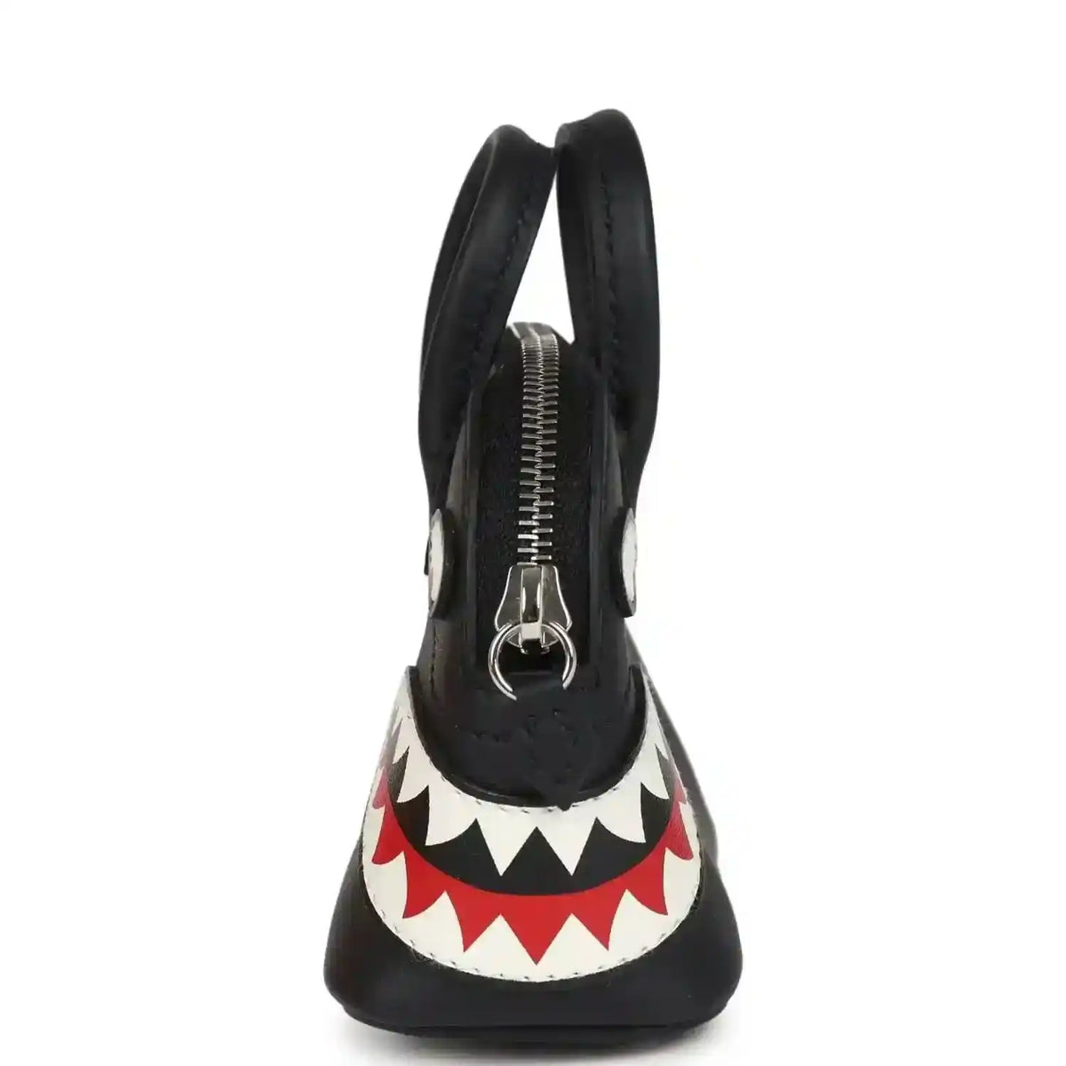 Black mini bag charm with top handles, visible zipper, and shark mouth graphic