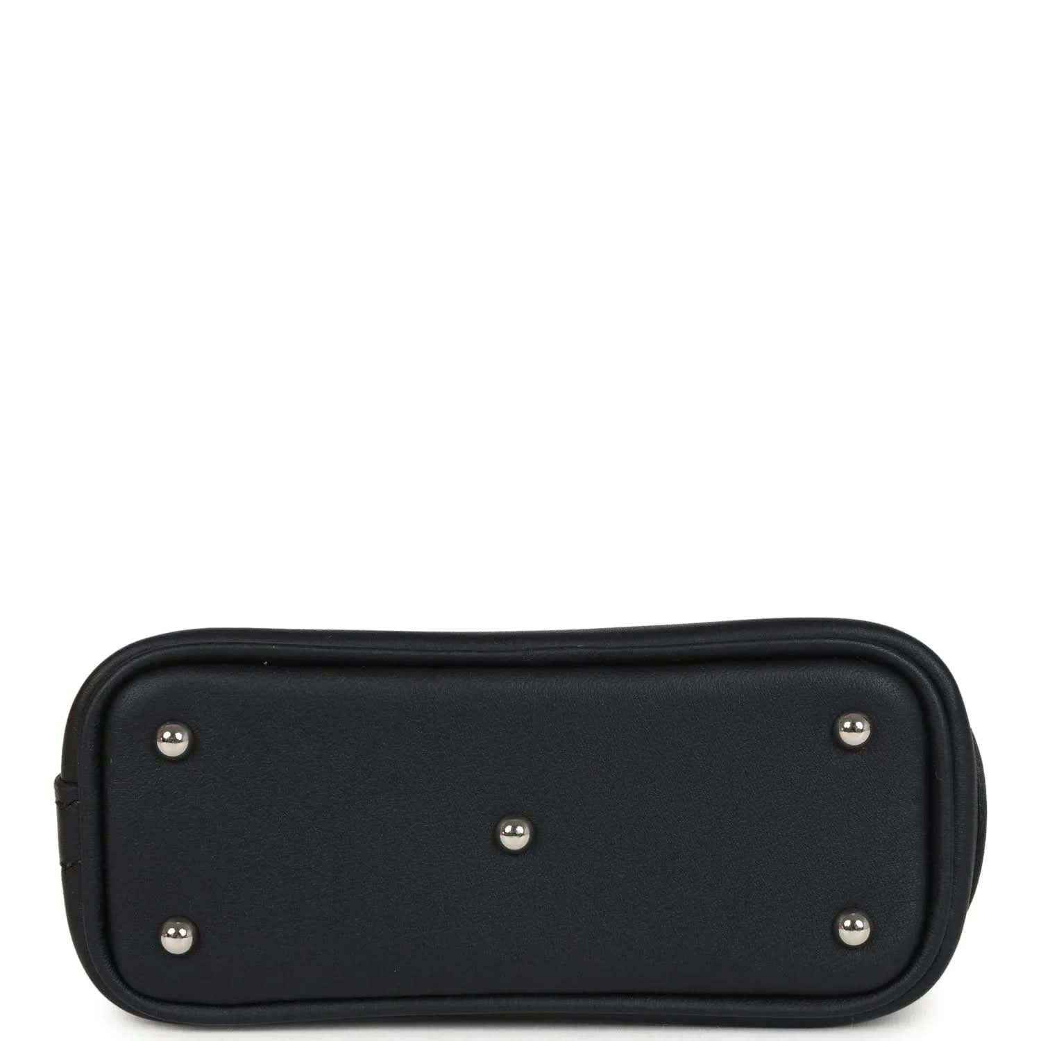 Black mini bag charm back panel with five metal studs and rounded shape