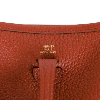 Hermes Evelyne TPM bag in dark copper textured leather with Hermes Paris stamp