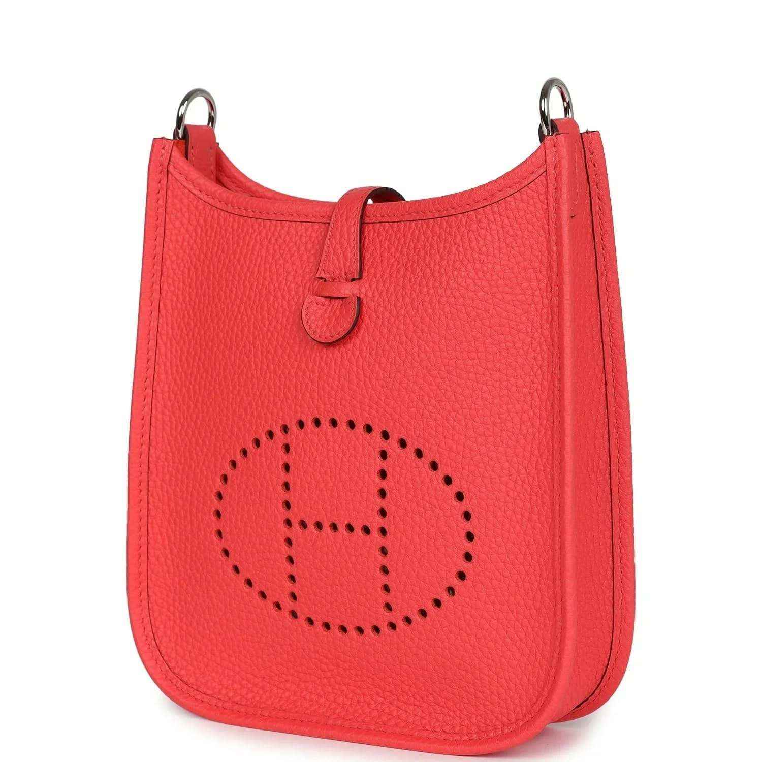 Red leather mini handbag with perforated E logo and side strap detail.