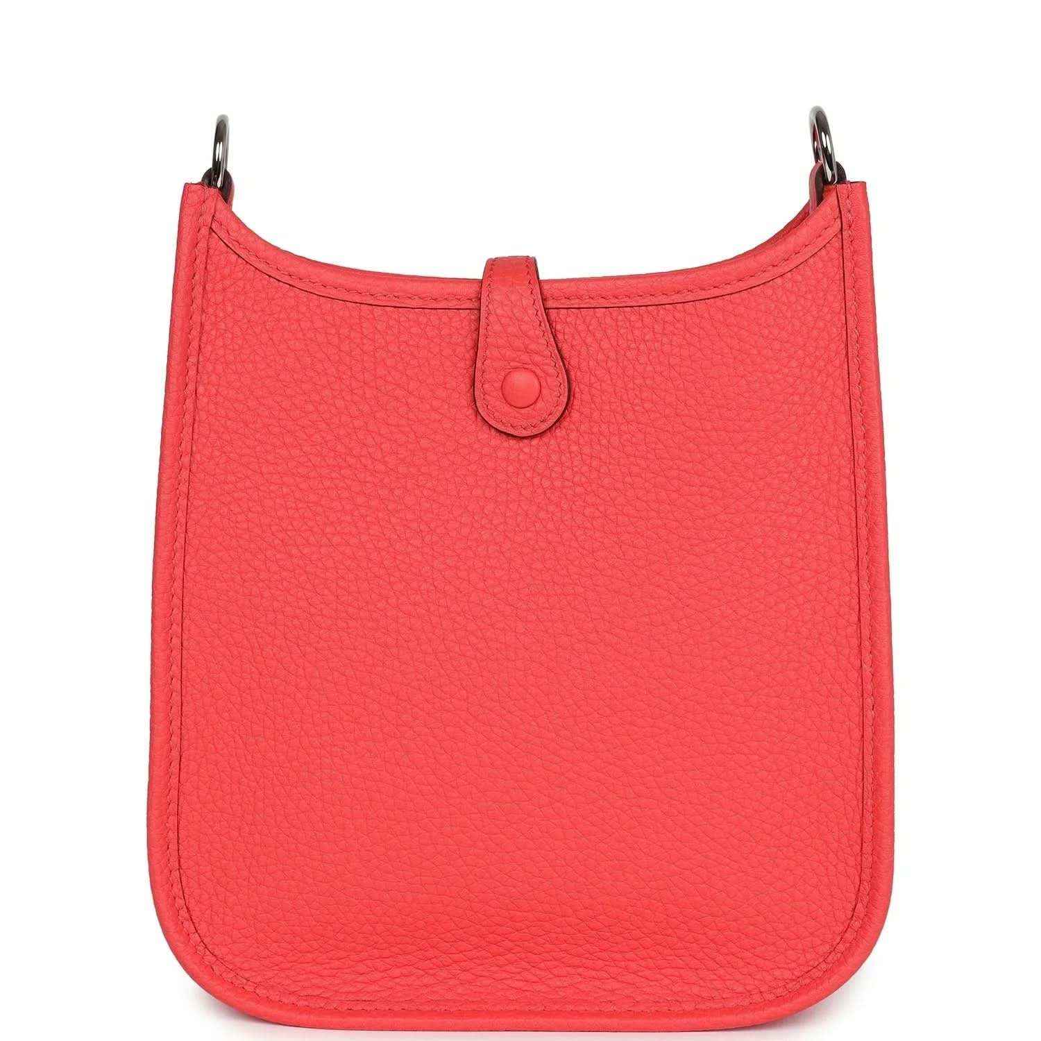 Red leather mini handbag with top handle and curved scalloped silhouette.