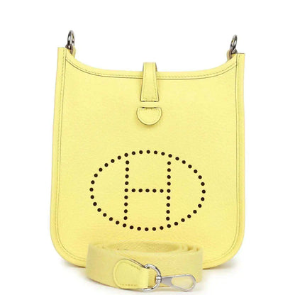 Lemon-yellow leather shoulder bag with front Evelyne logo and strap