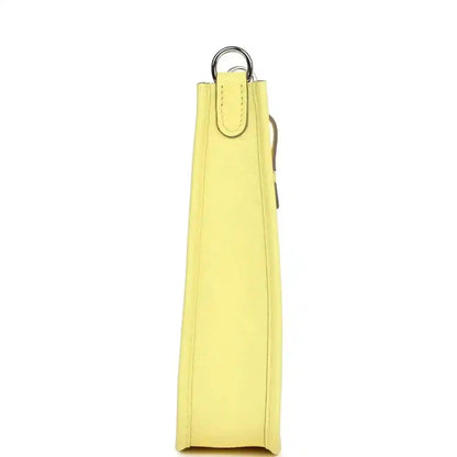 Lemon-yellow leather shoulder bag side view with vertical strap loop
