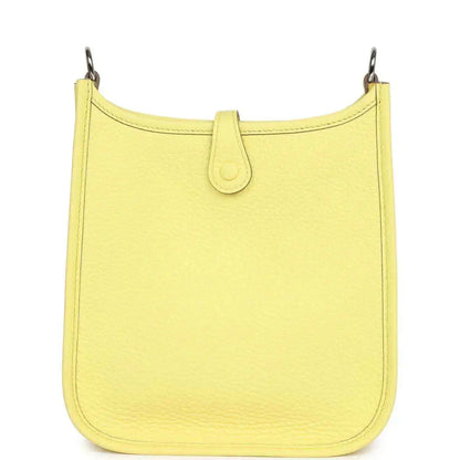 Lemon-yellow leather shoulder bag with top handle and smooth front