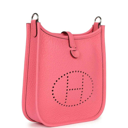 Pink Clemence leather Evelyne TPM crossbody bag with perforated logo, side view