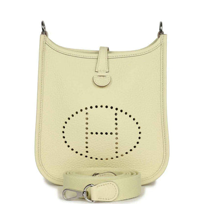 Light yellow leather mini crossbody bag with perforated 'E' logo