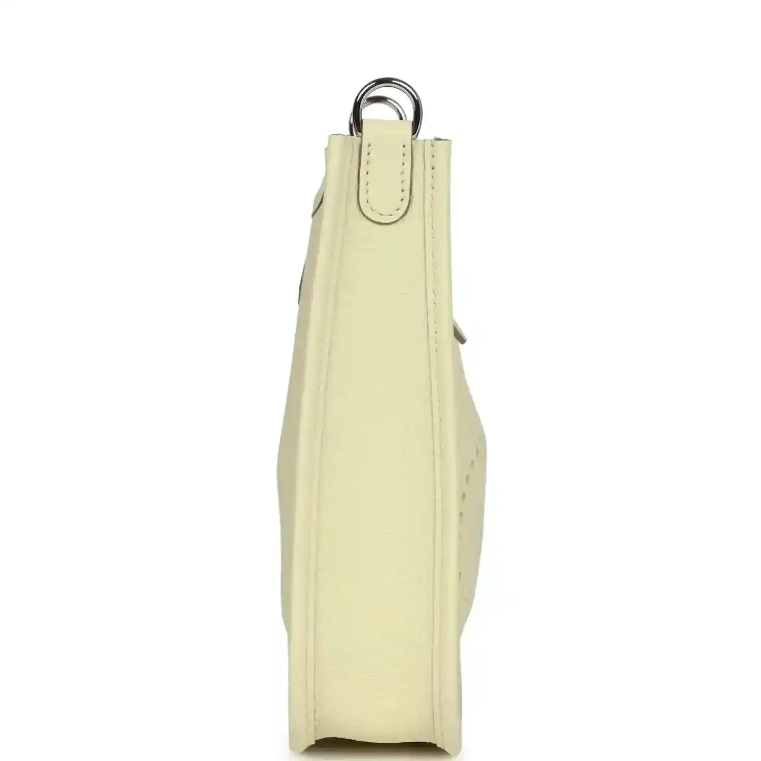 Light yellow leather mini crossbody bag, vertical side view with loop handle