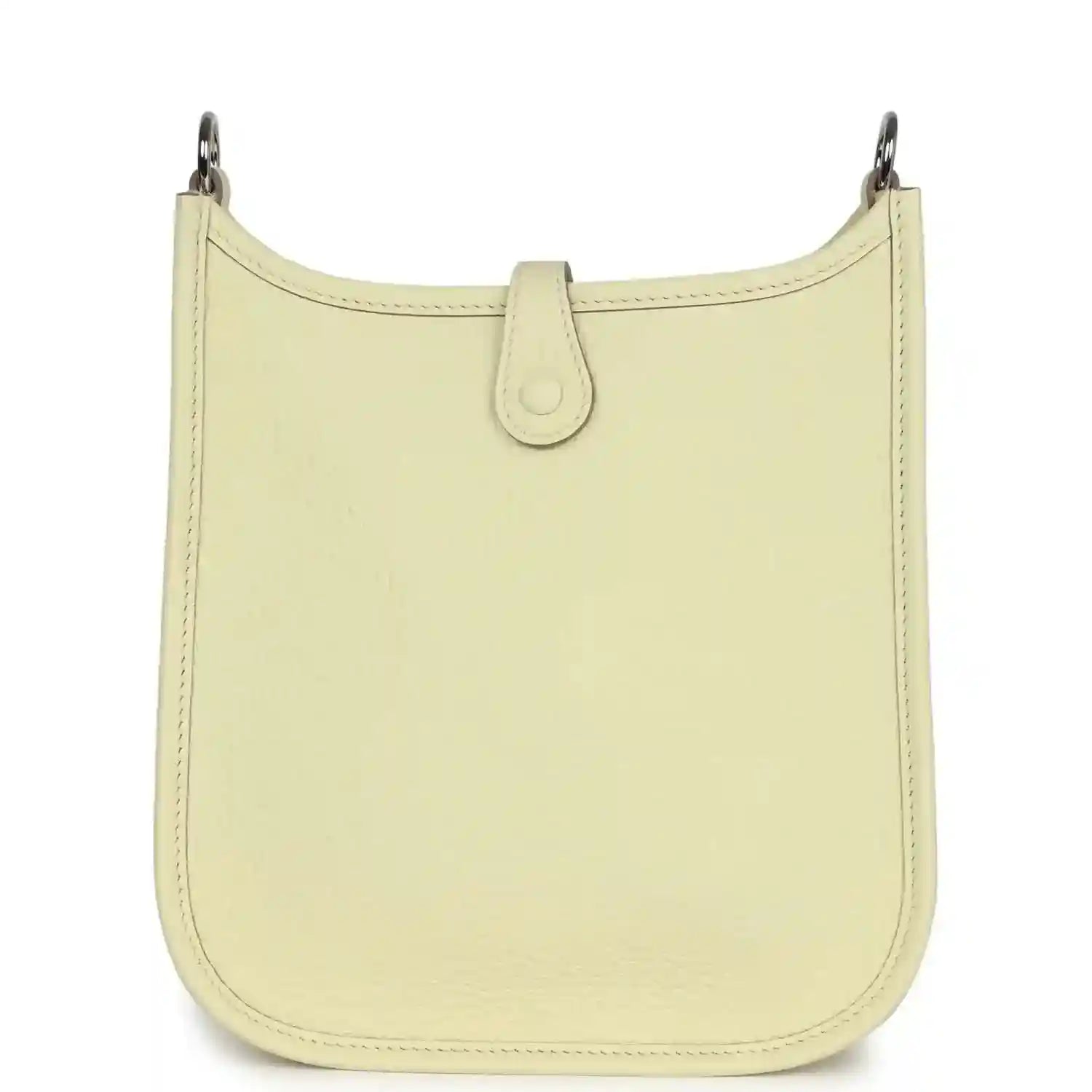Light yellow leather mini crossbody bag with clean front panel and top loop