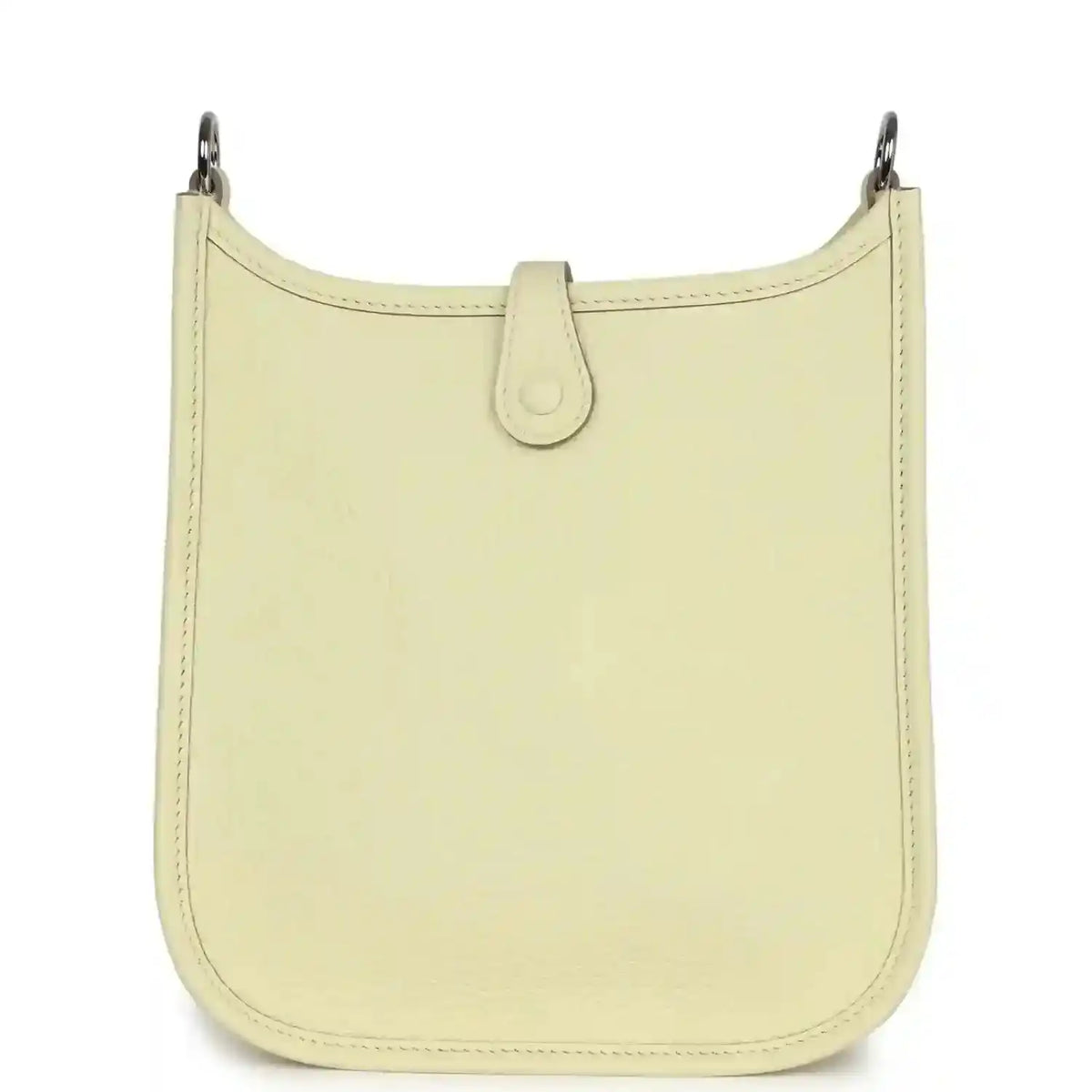 Light yellow leather mini crossbody bag with clean front panel and top loop