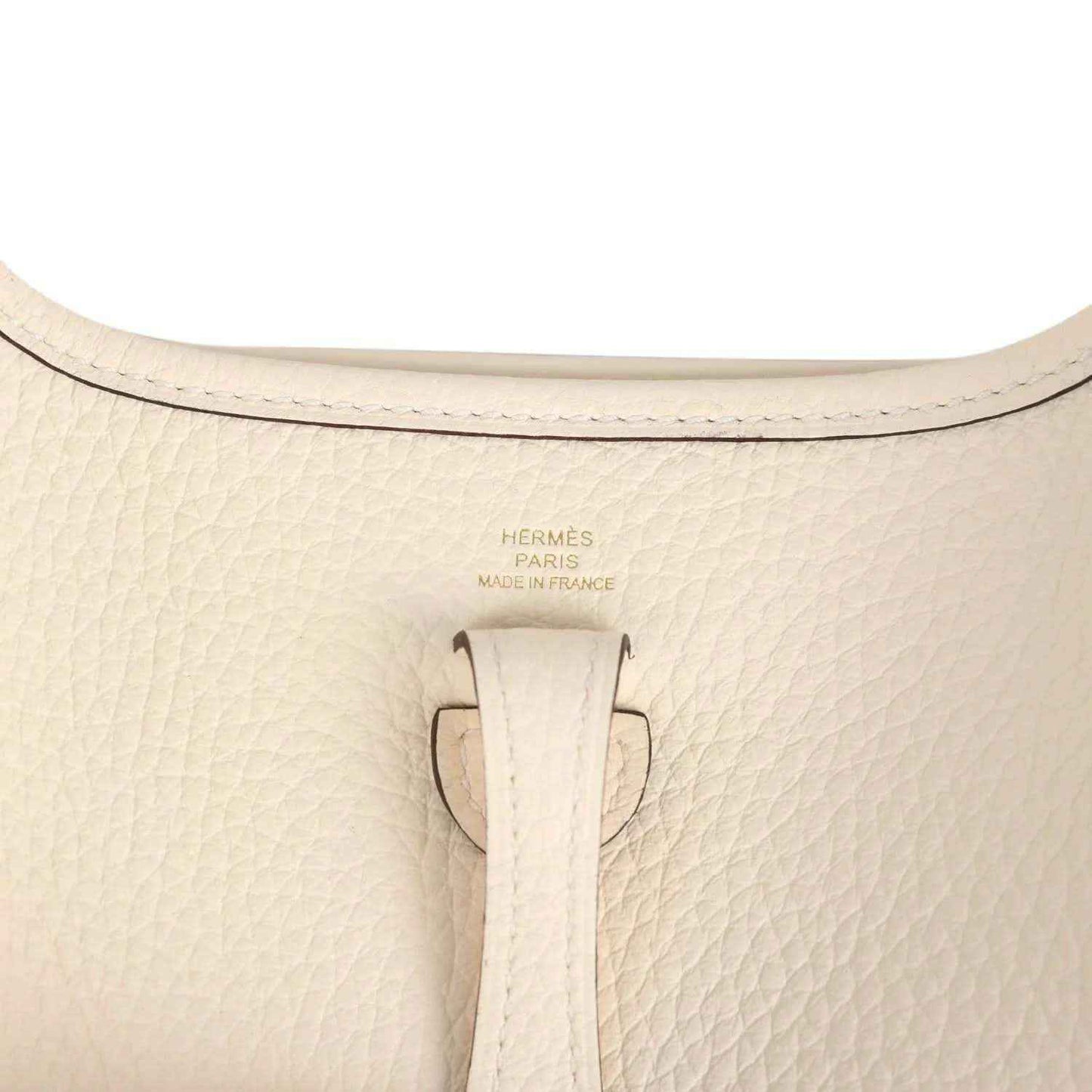 Beige textured leather top with 'Hermès Paris Made in France' stamp