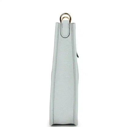 Evelyne TPM bag in pale blue grained leather, tall side view with top loop handle